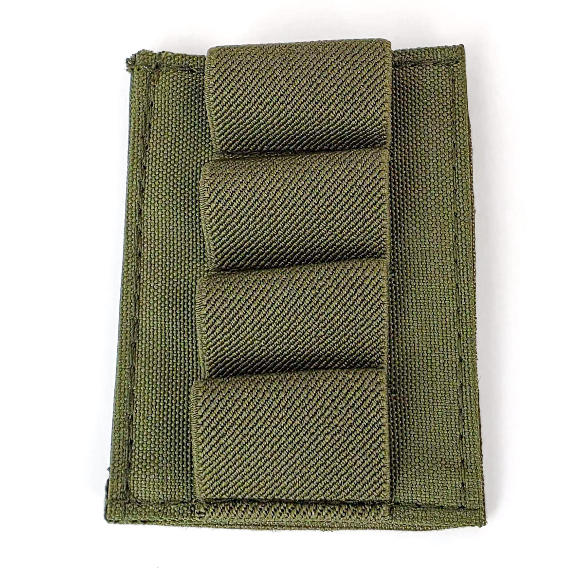 Close-up of the green BFly 4-round holder showing four elastic loops