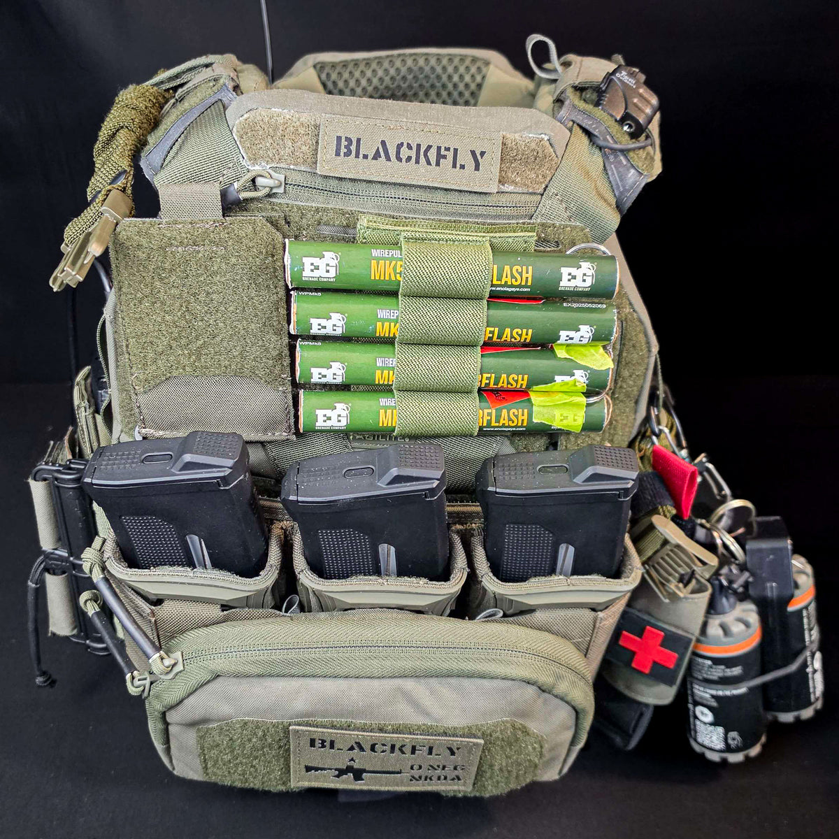 Green BFly 4-round holder with four MK5 thunderflash grenades mounted on a plate carrier velcro panel (grenades not included)