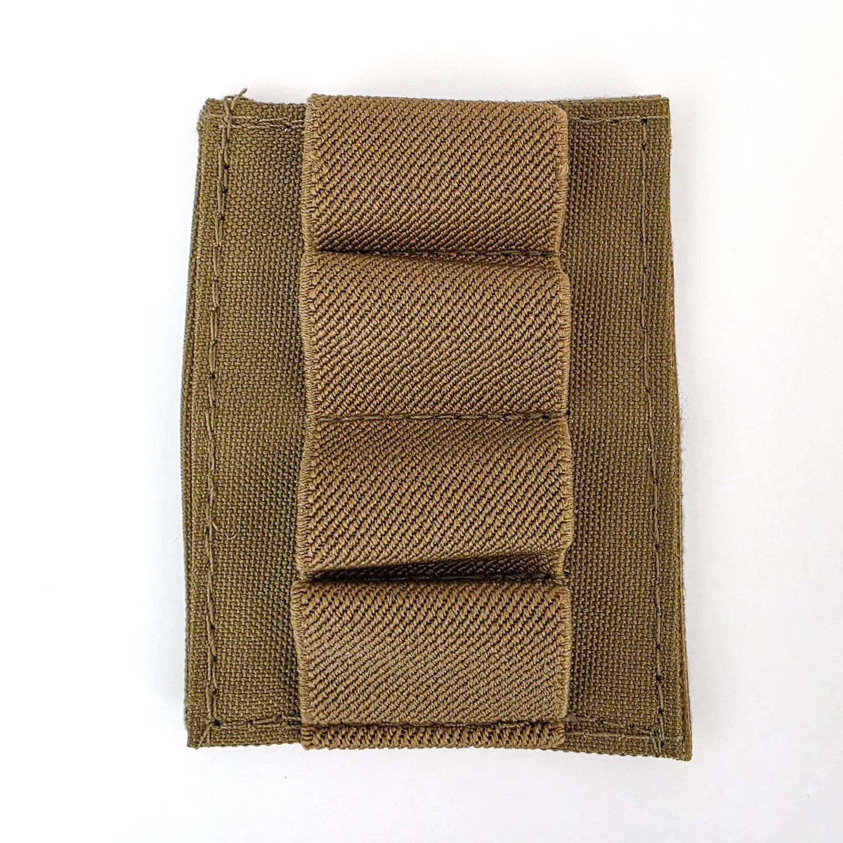 Close-up of the tan BFly 4-round holder showing four elastic loops