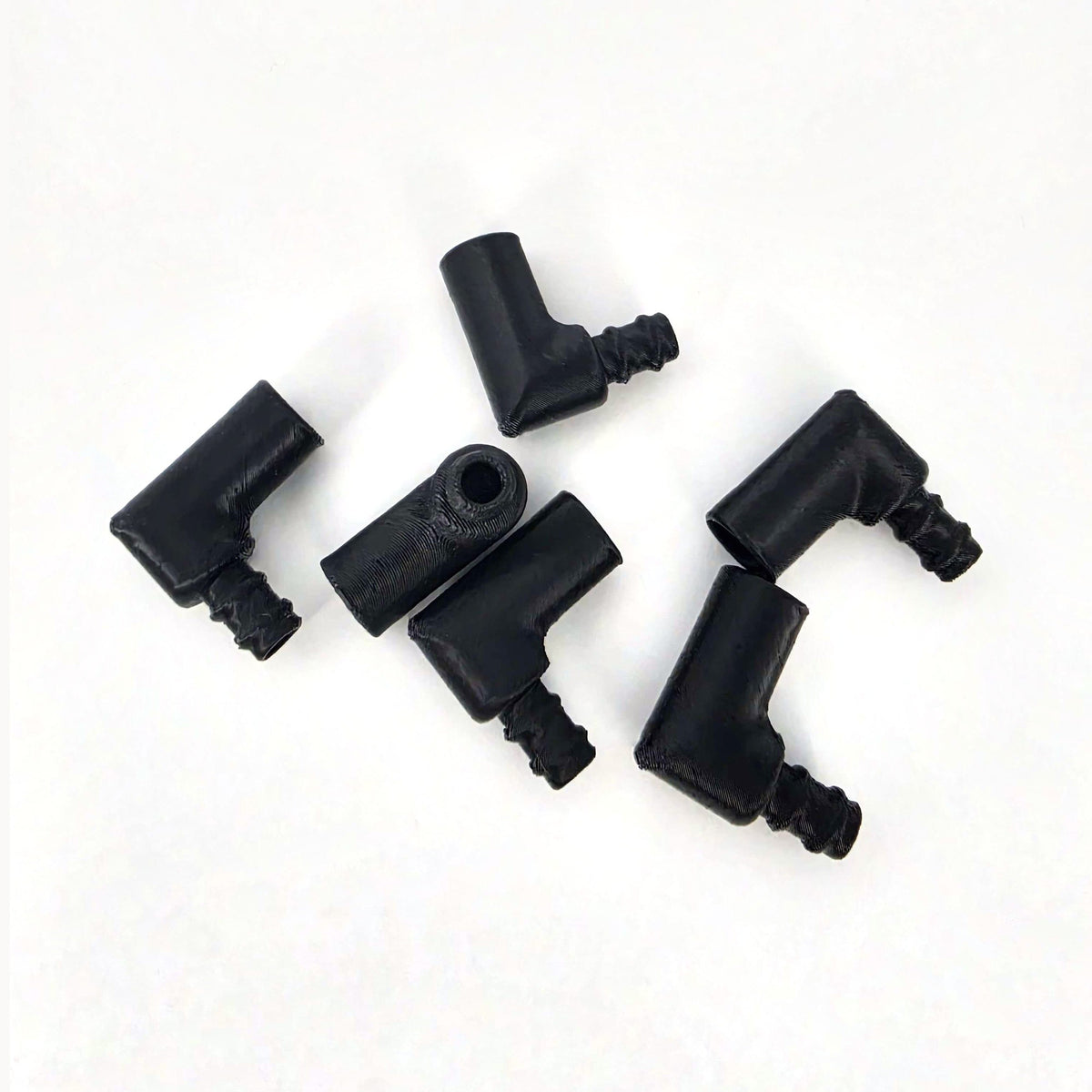 ExFog-size Clearflow replacement elbows showing barbed tubing ends