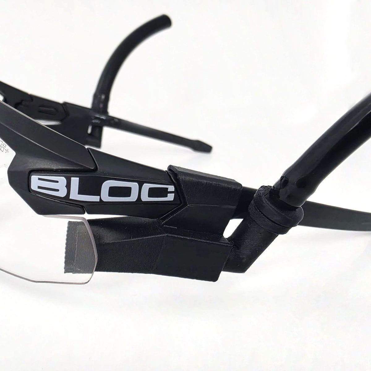 Magnetic 90 degree insert connected to ExFog tubing on a Clearflow Adapter mounted to tactical glasses