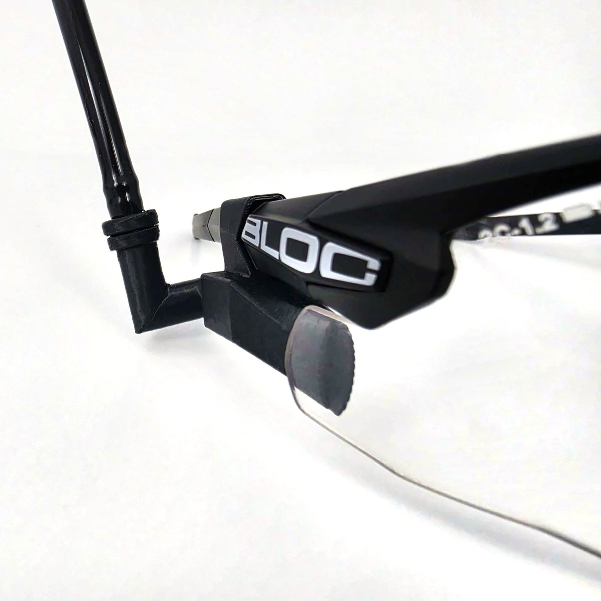 Echo offset insert on a Clearflow Adapter routing ExFog tubing on tactical glasses